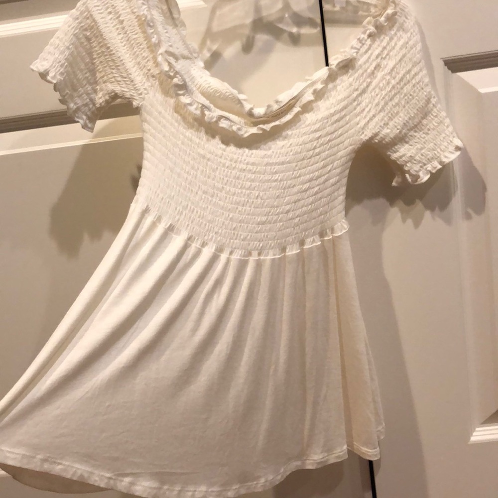 A white ruffled off the shoulder top